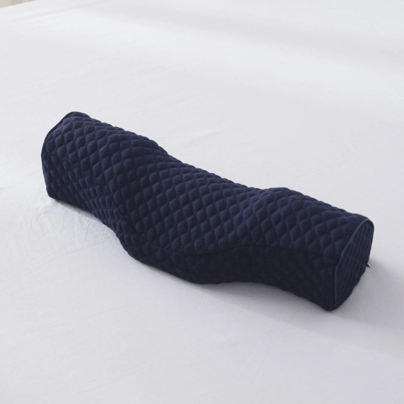 Dark blue orthopedic neck pillow with quilted cover, designed for pain relief and ergonomic neck support.